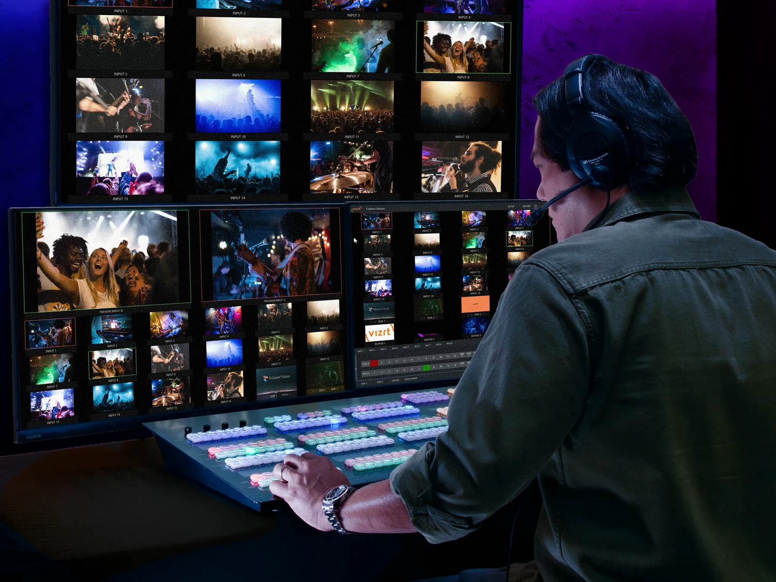 An operator working a Vizrt Flex Dual control panel in front of a live multiviewer wall