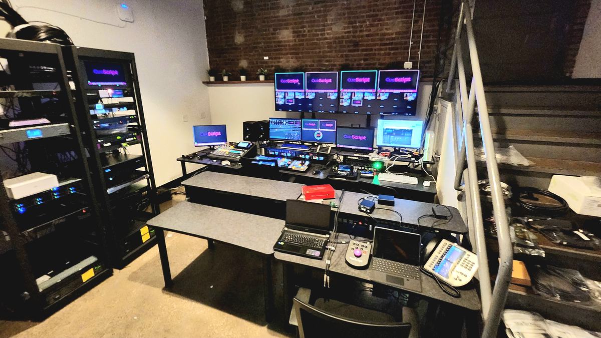 Control room built by Varto for a national daily show: operator desk, monitor bank and equipment racks against exposed brick