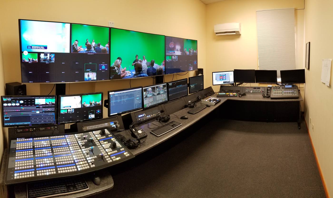 Control room consoles and monitor wall, wired to the studio floor