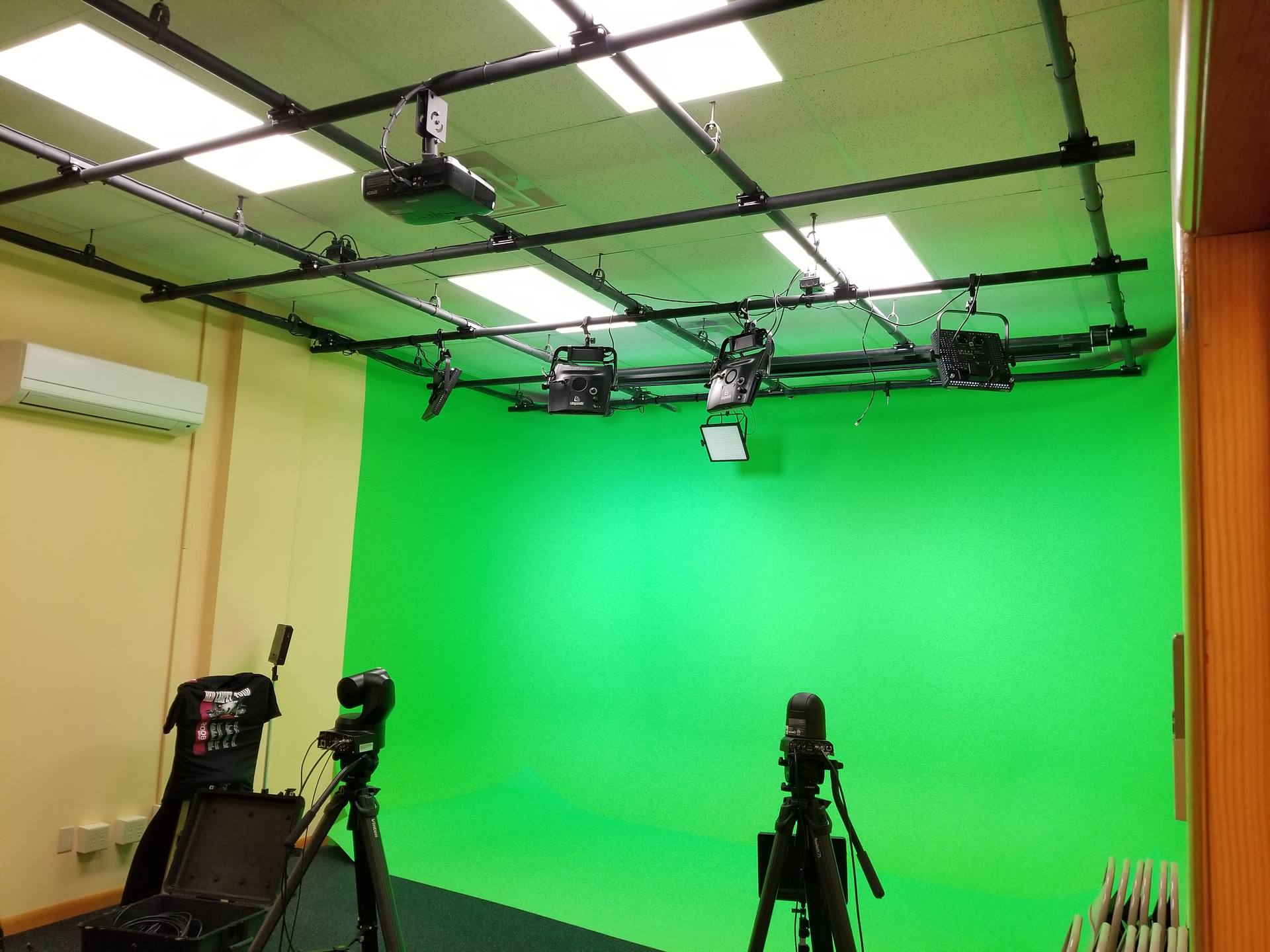 The green cyc lit under the grid, camera on the studio floor