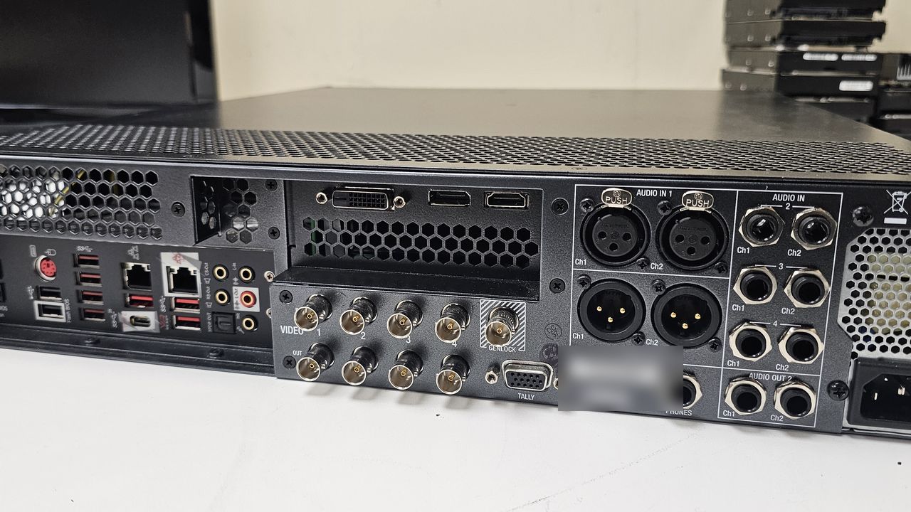 The rear connector panel of a TriCaster on the intake bench, waiting on diagnosis