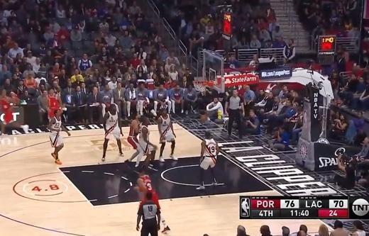A virtual shot clock graphic over a live basketball broadcast, manufacturer imagery