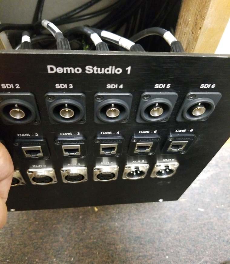 A labeled SDI and network plate, wired and documented at the Varto facility