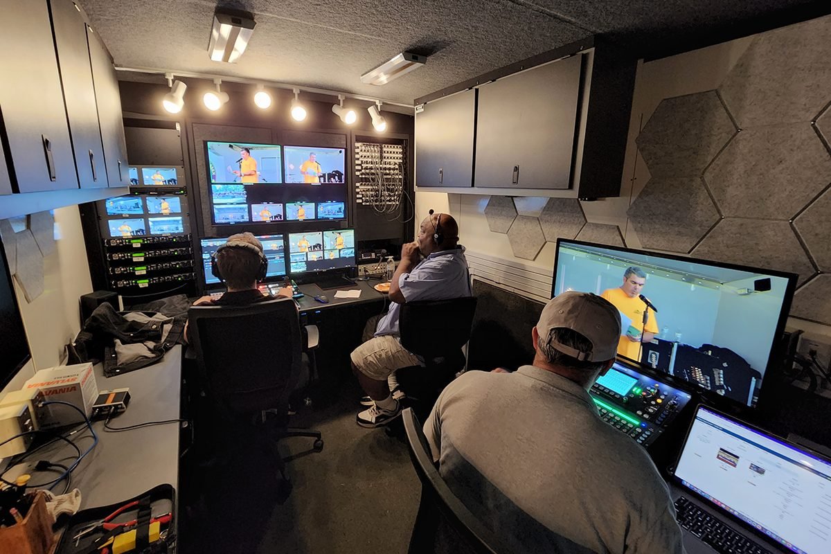 Inside WBMA-TV Bloomfield's production truck, crew live during a show, a mobile control room Varto stands behind
