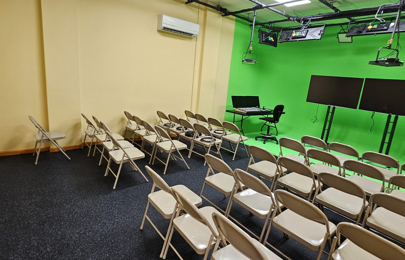Rows of chairs on the Varto training floor in East Rutherford facing the cyclorama, lighting grid and monitors
