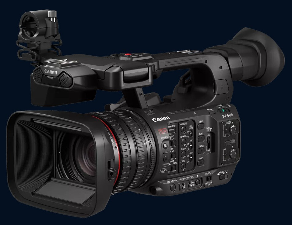 Canon XF605 camcorder, front three-quarter view with its lens hood and top handle