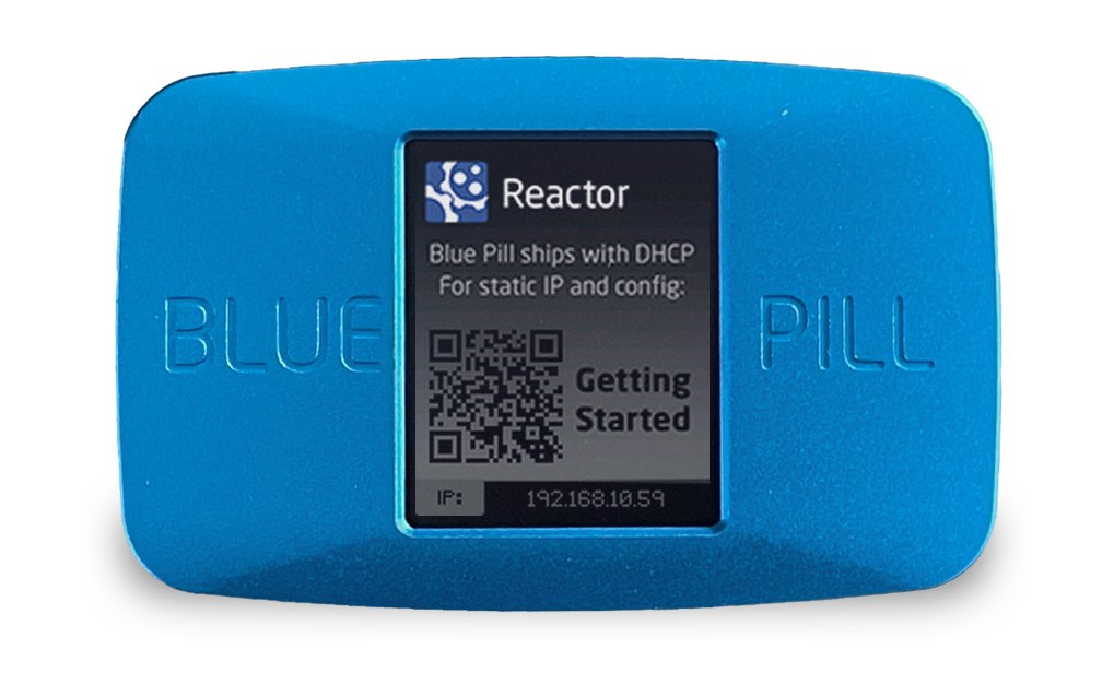 A blue SKAARHOJ Blue Pill unit with a small screen showing setup information