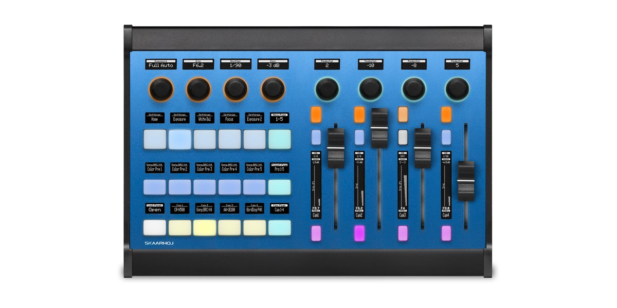 A SKAARHOJ Color Fly panel seen from above, with encoders, buttons and four faders