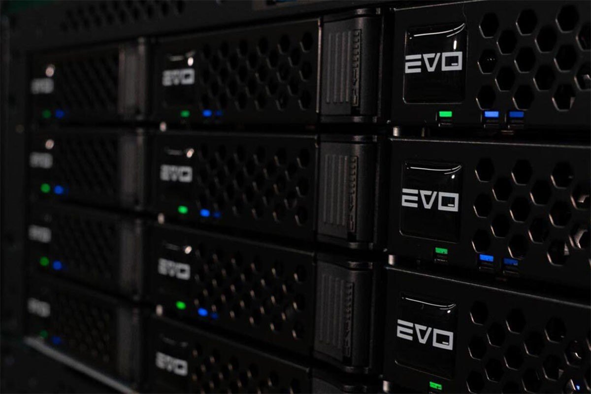 SNS EVO shared storage servers stacked in a rack with drive bays lit