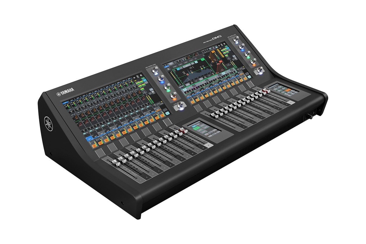 A Yamaha DM5 console with two touchscreens and two fader bays