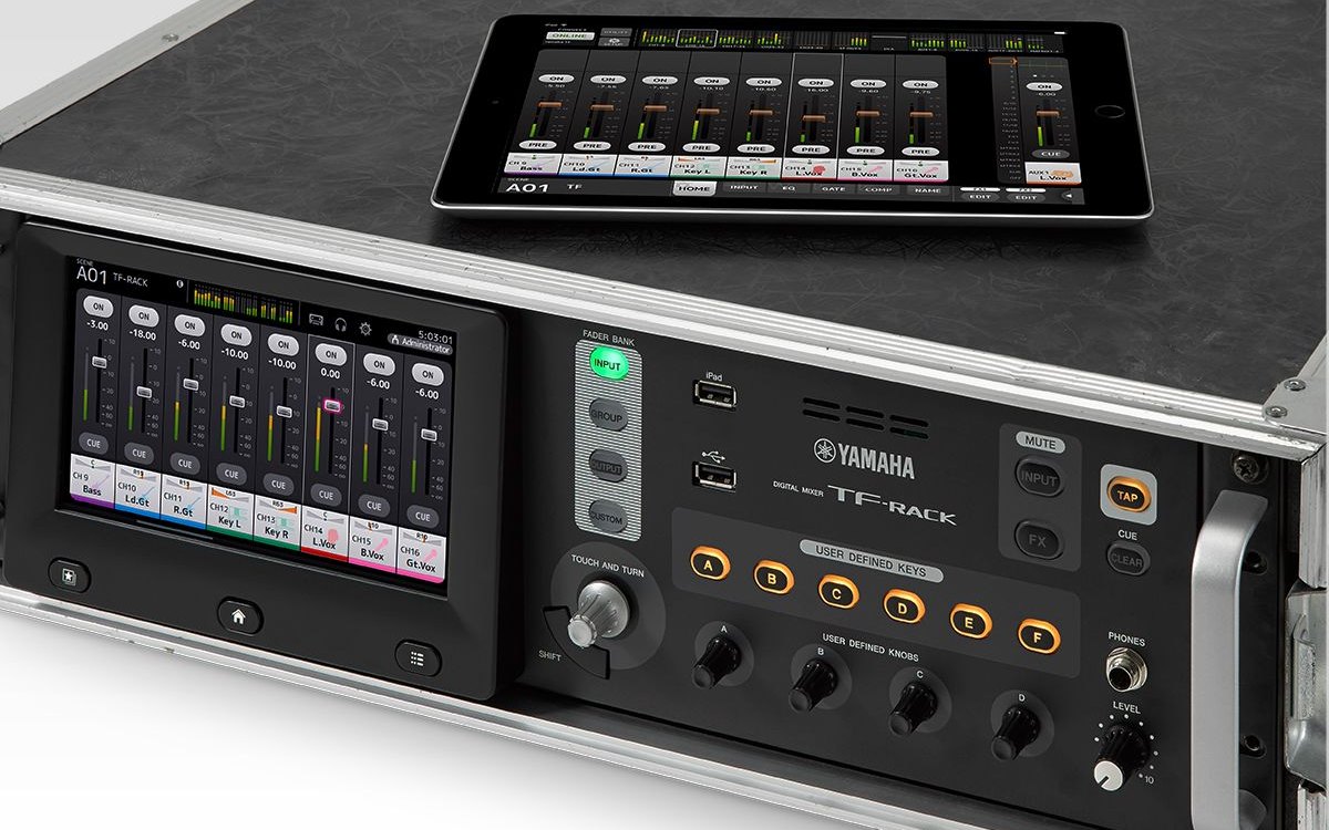 A Yamaha TF-RACK mixer in a road case with an iPad on top running the mixing app
