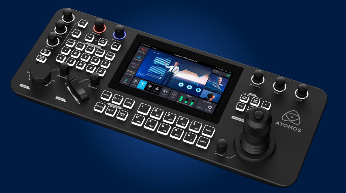 The Atomos A-Eye PTZ Controller Pro, with a 7-inch touchscreen, rows of buttons, knobs and a joystick, on a blue background