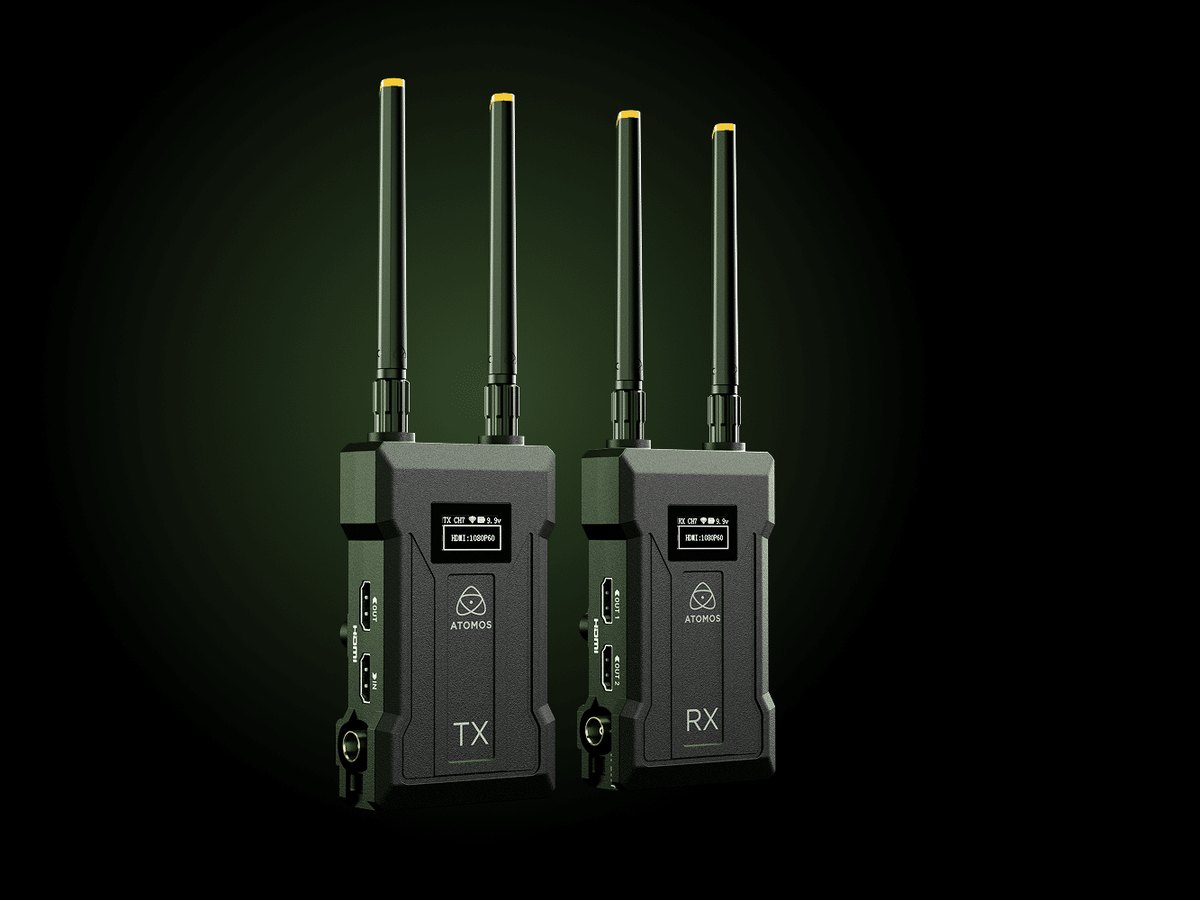 The Atomos TX transmitter and RX receiver, two small units with twin antennas and status displays, on a dark background