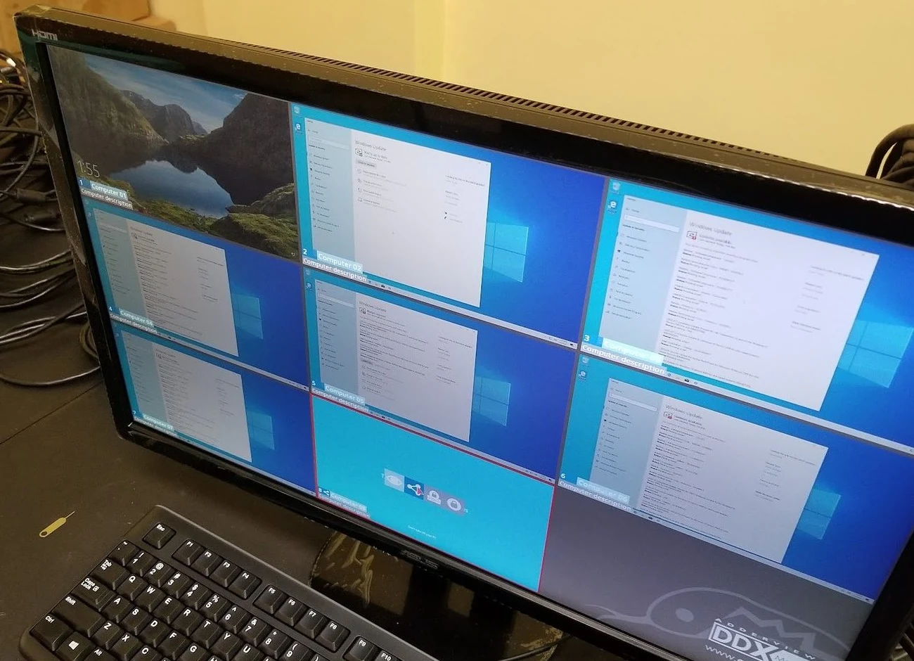 An ADDERView DDX matrix on-screen display at Varto Technologies, showing eight computer desktops as selectable tiles
