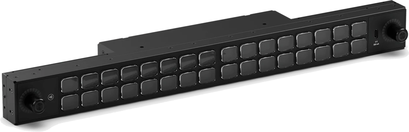 A black Elgato Stream Deck Studio rack panel with two rows of blank keys and a push encoder at each end
