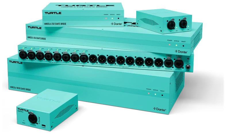 A stack of teal Turtle AV Mineola Dante bridges of several sizes with rows of XLR connectors, and a small two-channel unit in front